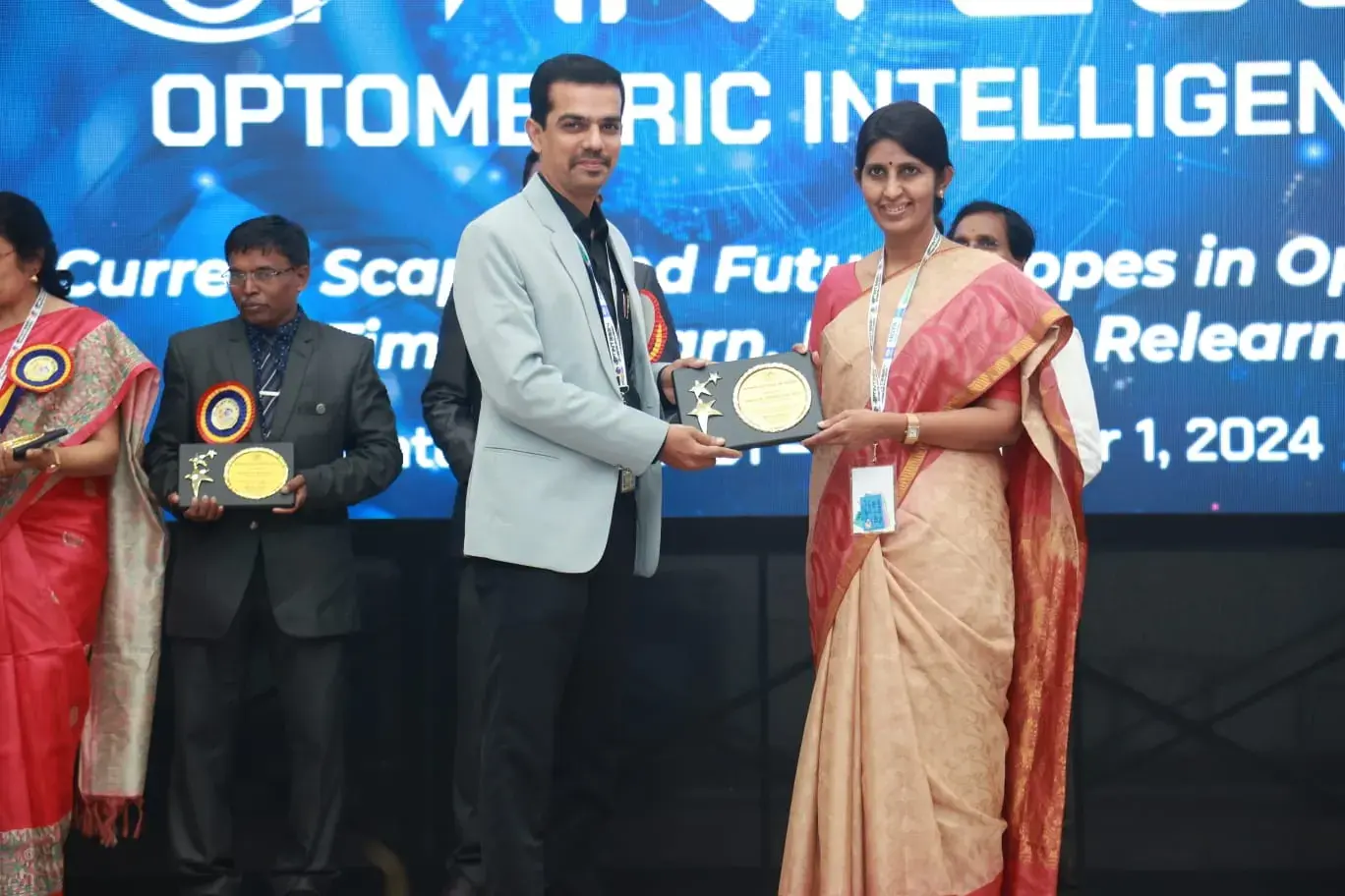 Receiving a memento at OPTINT 2024